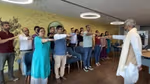 Group of people with arms raised