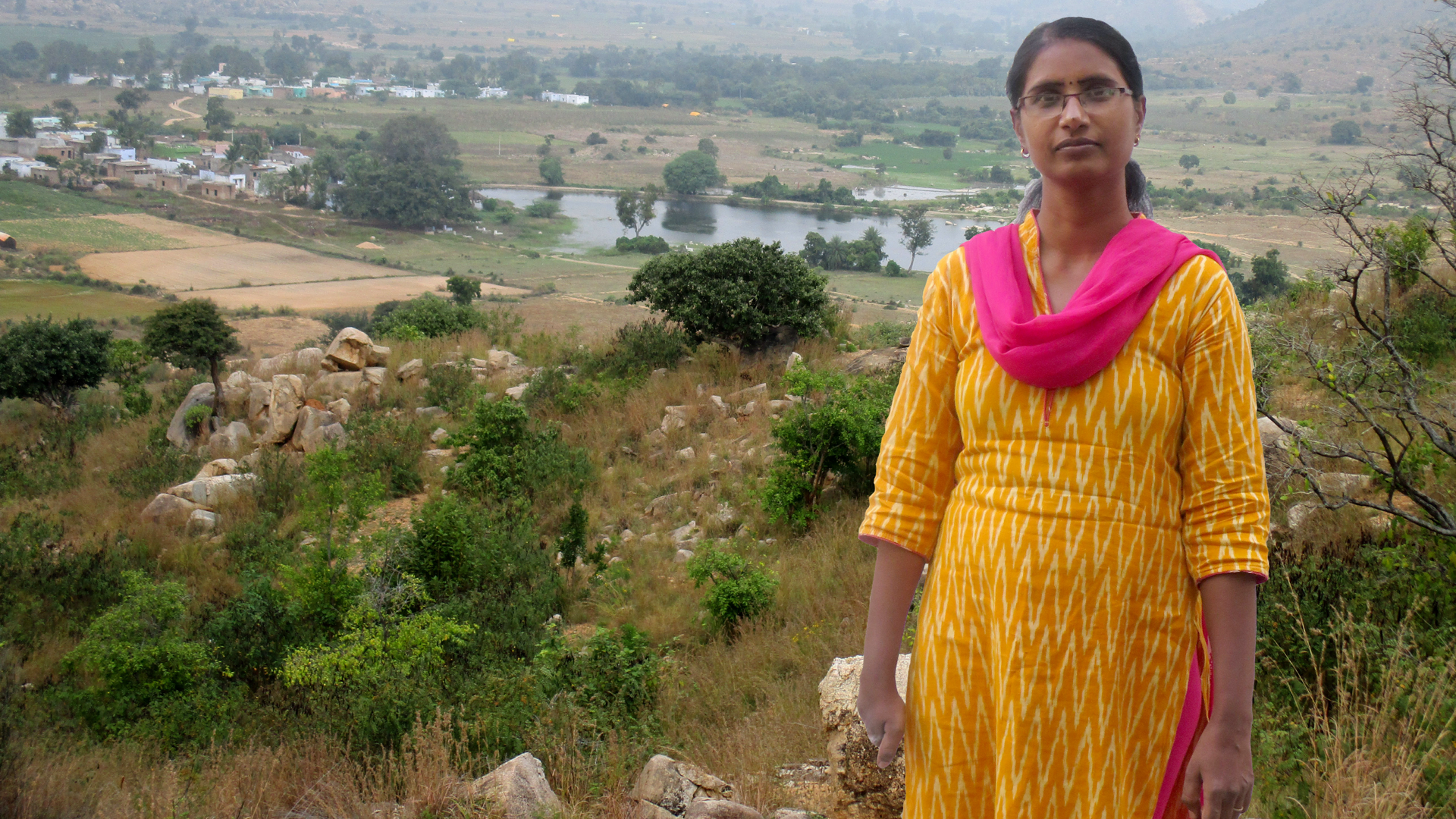 Woman stood in front of landscape