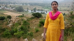 Woman stood in front of landscape