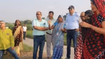 A group of people standing in a field