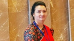Woman stood in front of marble wall