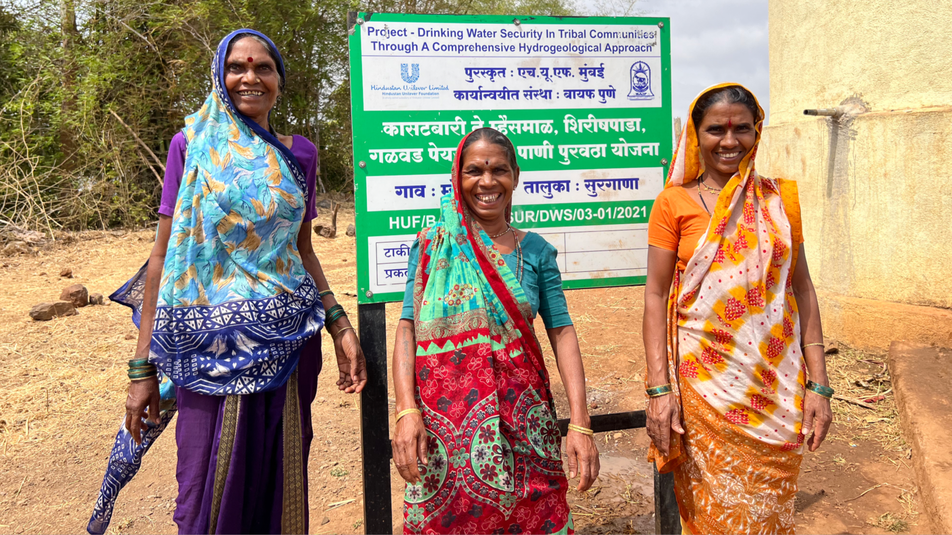 Women stood near sign