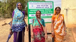 Women stood near sign